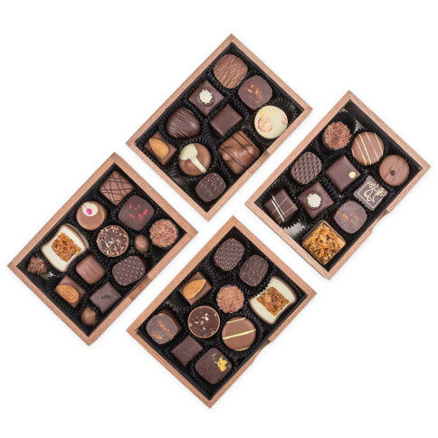 hand made pralines in wooden boxes